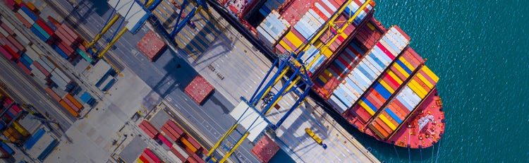Cargo port filled with colorful shipping bins and lined paths