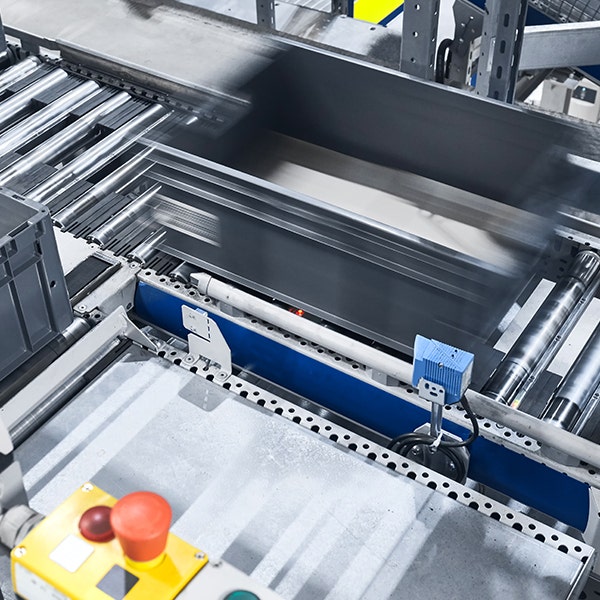 High-tech automation distributor during assembly showing a crate go past
