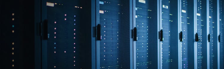 Data Center filled with lines of grey servers in storage units