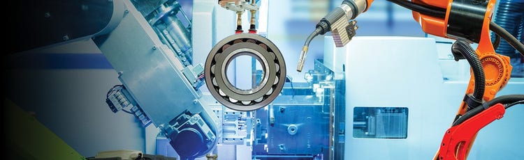 Orange robotic arm welding a gear with an assembly line in the background