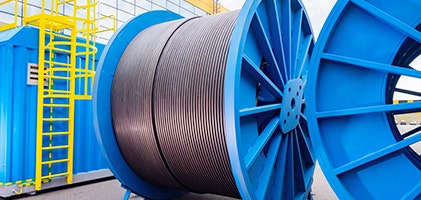 Grey wire wound up in a blue wire reel holder