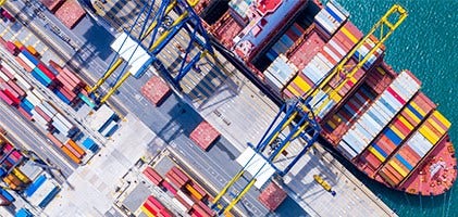 Cargo port filled with colorful shipping bins and lined paths
