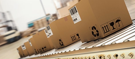 Boxes lined up on a conveyor belt to be shipped