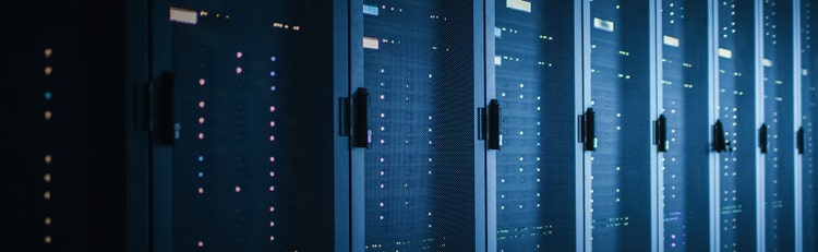 Data Center filled with lines of grey servers in storage units